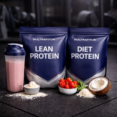 NULTRAFITUK lean and diet protein powders with shaker bottle, strawberries and coconut ingredients displayed on a rubber gym floor in a dark gym environment.