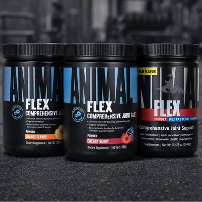 Three containers of Animal Flex supplement on a dark surface with a blurred background
