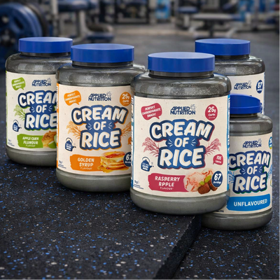 Applied Nutrition Cream Of Rice tubs on a gym floor