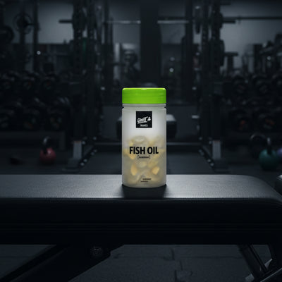 Ghost Basics Fish Oil supplement container on a gym background