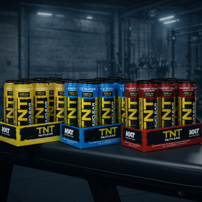 Assorted boxes of TNT Nuclear products in a gym setting