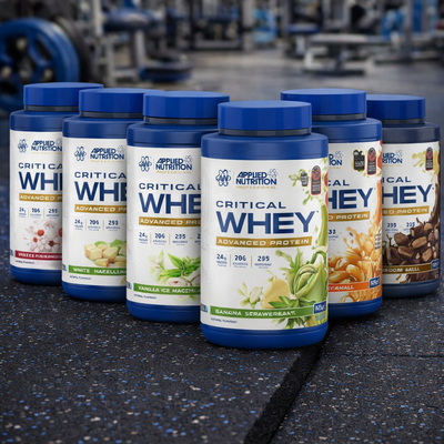 Applied Nutrition Critical Whey Tubs on a gym floor