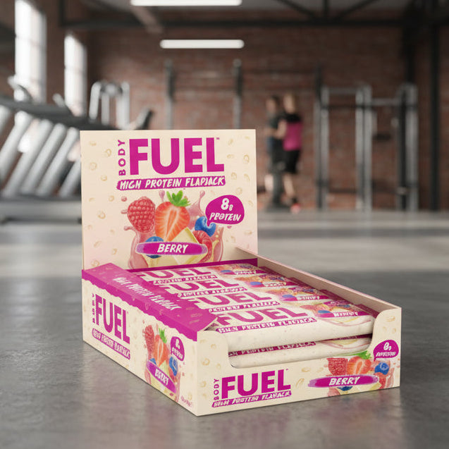 Box of Body Fuel High Protein Flapjack Berry flavour on a gym background