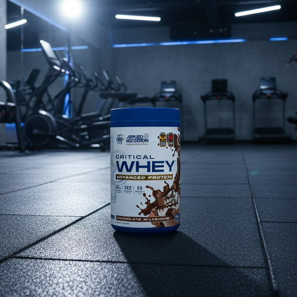 Applied Nutrition Critical Whey Tub on a gym floor
