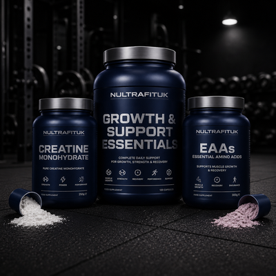Creatine and BCAA supplement tubs in front of gym weights on a misty background