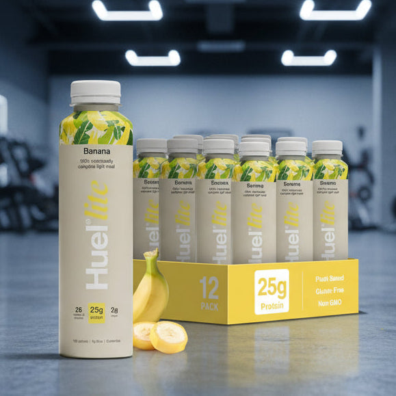 HUEL Lite Ready-to Drink banana flavour case on a gym floor.