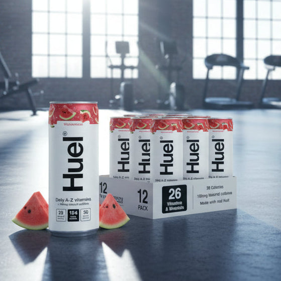 HUEL Daily A-Z Vitamin watermelon flavour Cans on a gym floor