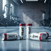 HUEL Daily A-Z Vitamin Cherry raspberry flavour Cans on a gym floor