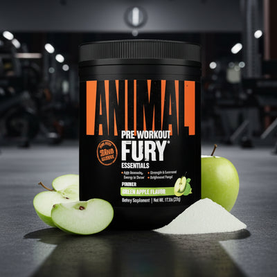 Container of Animal Pre Workout Fury with apples and powder on a gym floor.