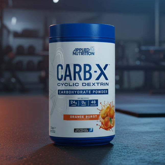 Applied Nutrition Carb-X Cyclic Dextrin powder container on a gym floor