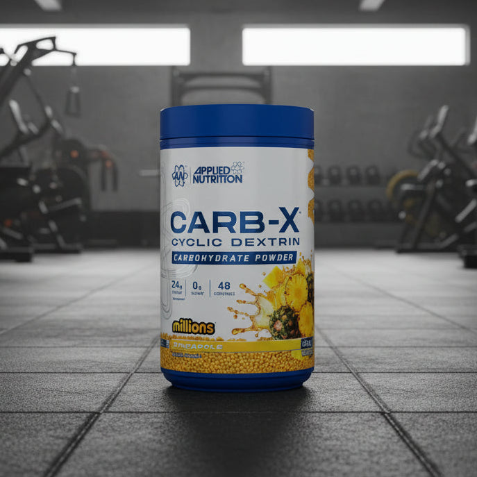 Applied Nutrition Carb-X Cyclic Dextrin powder container on a gym floor