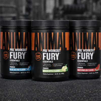 Three containers of Pre Workout Fury Essentials on a textured surface with a blurred background.