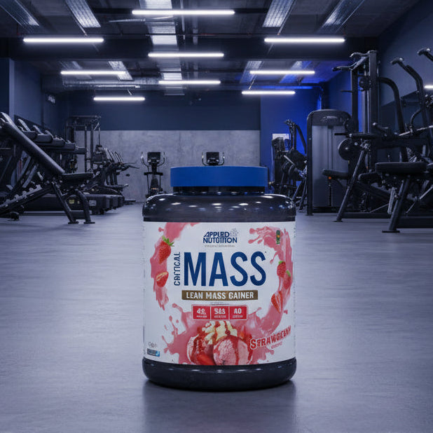 Applied Nutrition Critical Mass Professional strawberry flavour on a gym floor