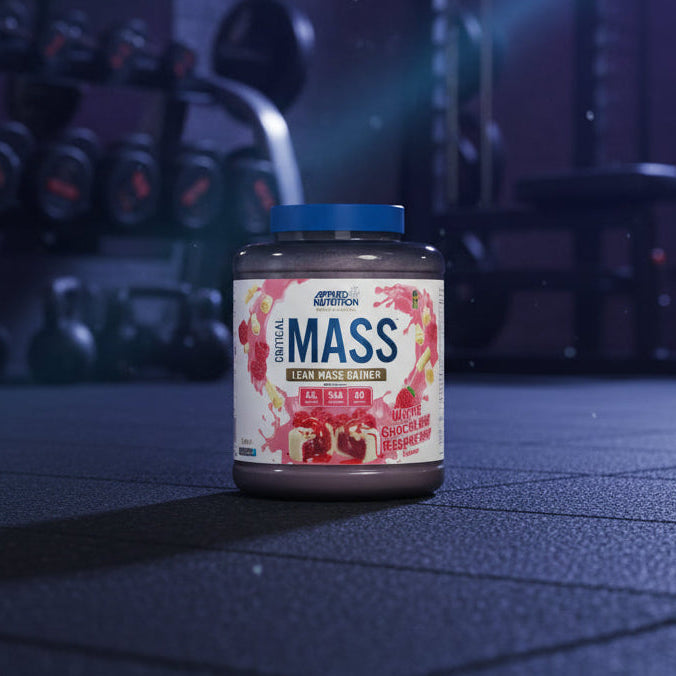 Applied Nutrition Critical Mass Professional white chocolate raspberry flavour on a gym floor