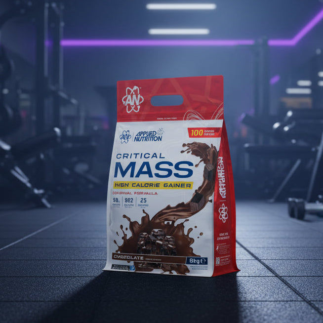 Applied Nutrition Critical Mass High Calorie Gainer package on a gym background