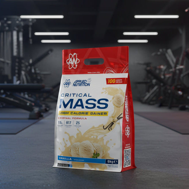 Applied Nutrition Critical Mass High Calorie Gainer package on a gym background