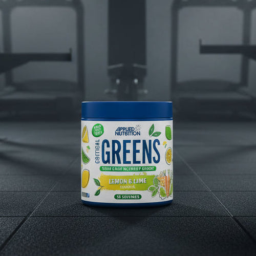 Applied Nutrition Critical Greens supplement container with lemon and lime flavour on a gym background