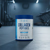 Collagen peptides container with blue and white label on a gym background
