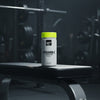 Supplement bottle labelled 'Vitamin C + Glutathione' with a yellow cap on a gym bench, featuring the Kong and Ghost Supplements logos.