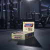 Box of Snickers Hi Protein Low Sugar bars on a gym background