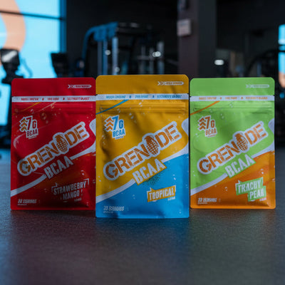Grenade BCAA supplement packages with strawberry mango flavour on a gym background