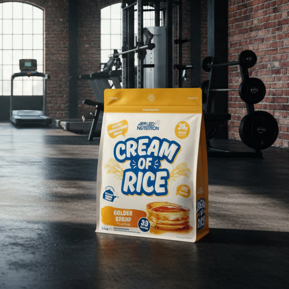 Bag of Applied Nutrition Cream of Rice Golden Syrup flavour on a gym background