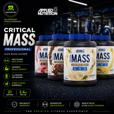 Four tubs of Applied Nutrition Critical Mass Lean Mass Gainer protein powder in dark blue and white packaging, displayed in a gym setting with promotional text on the left.