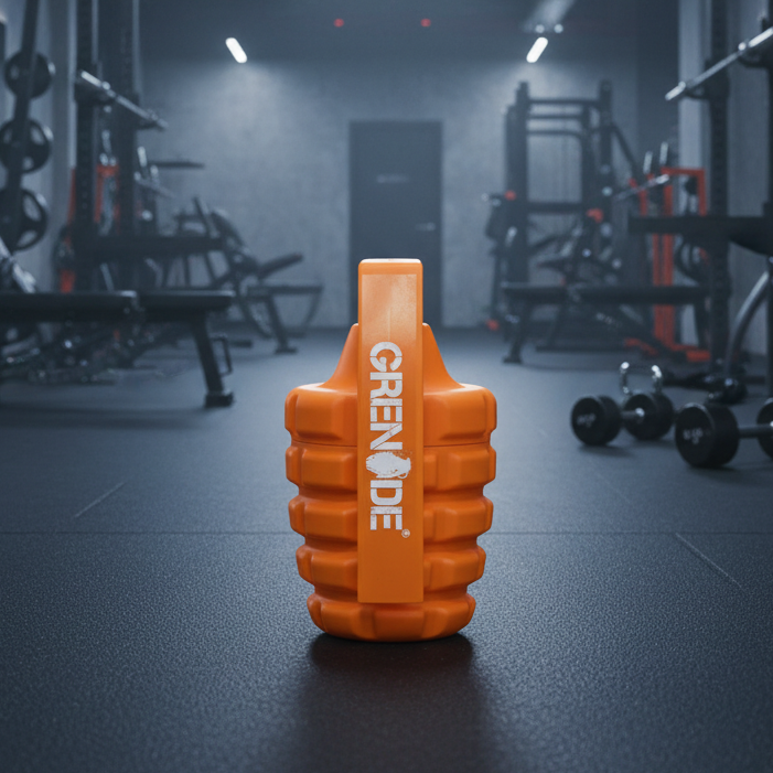 Orange Grenade supplement container in a gym setting