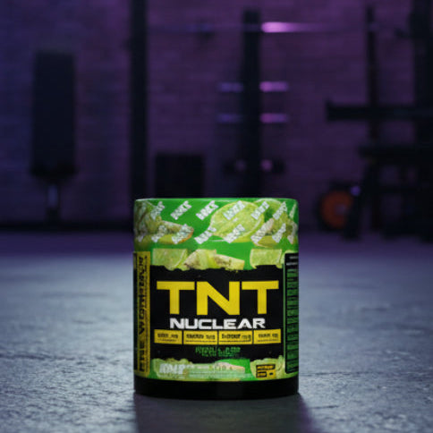 TNT Nuclear supplement container on a dark floor with a purple hue