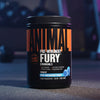 Pre-workout supplement container labeled 'Fury' in a gym setting