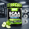 NXT Nutrition BCAA Glutamini Vitamin D supplement container with green apples in a gym setting