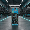 ABE All Black Everything pre-workout supplement bottle blue lagoon on a gym background
