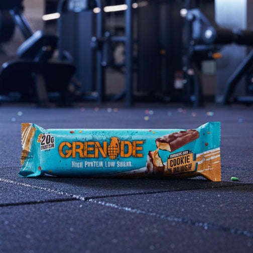 Crenade cookie butter bar on a gym floor with equipment in the background