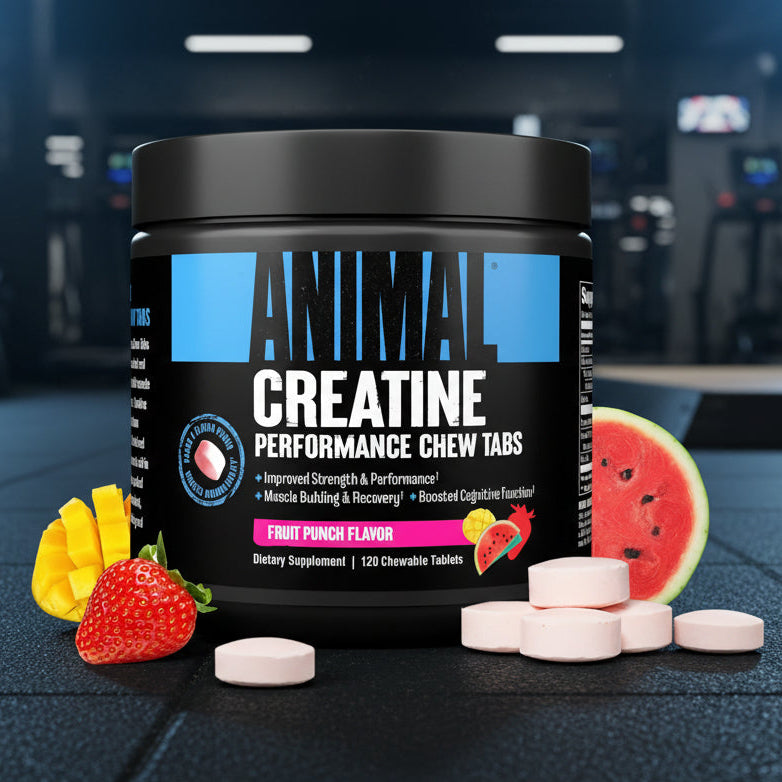 Container of Animal Creatine Performance Chew Tabs with fruit on a gym floor background