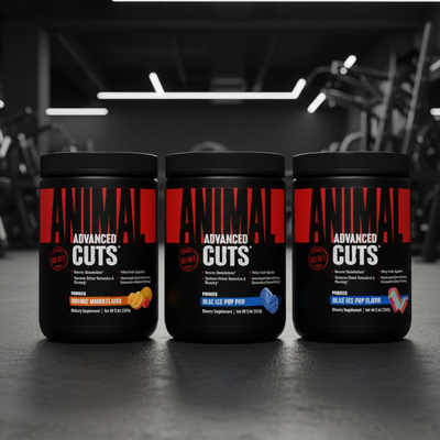 Three 'Animal Cuts' supplement containers on a gym floor.