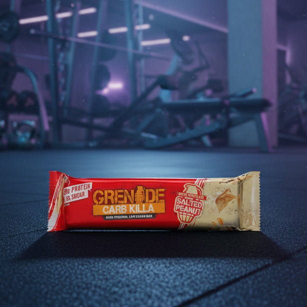 Grenade salted peanut flavour protein bar on a gym floor