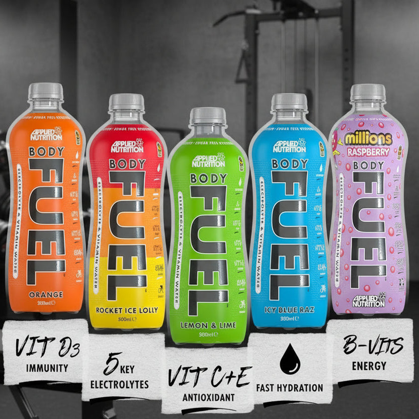 Five bottles of Body Fuel drinks in different flavors with a gym background.