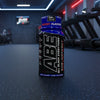 ABE All Black Everything energy drink bottle on a gym background