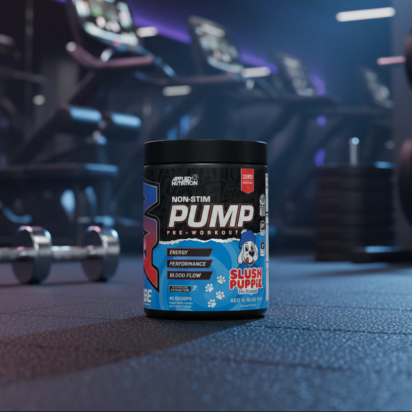 Pre-workout supplement container on a gym floor with equipment in the background