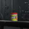 Ghost BCAA supplement container with colourful label on a gym background