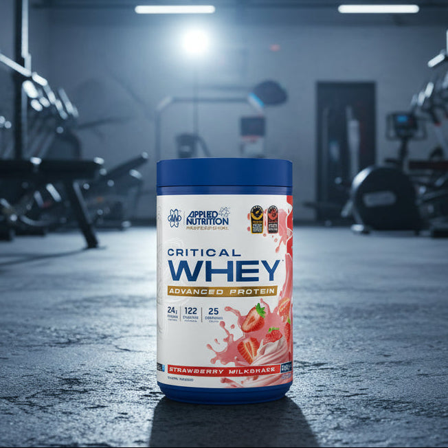 Applied Nutrition Critical Whey Tub on a gym floor
