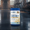 Applied Nutrition Critical Whey Tub on a gym floor