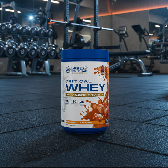 Applied Nutrition Critical Whey Tub on a gym floor