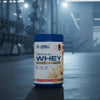 Applied Nutrition Critical Whey Tub on a gym floor