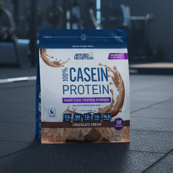 Package of Applied Nutrition 100% Casein Protein Powder in Chocolate Cream flavour on a gym background.