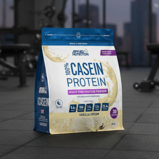 Package of Applied Nutrition 100% Casein Protein Powder with vanilla cream flavour on a gym background