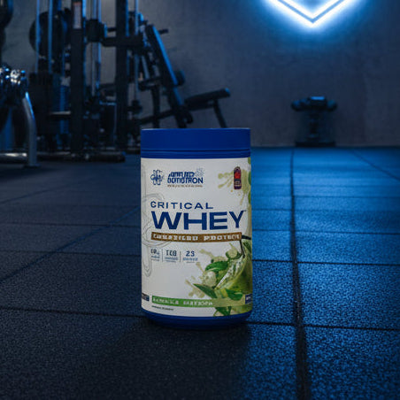 Applied Nutrition Critical Whey Tub on a gym floor