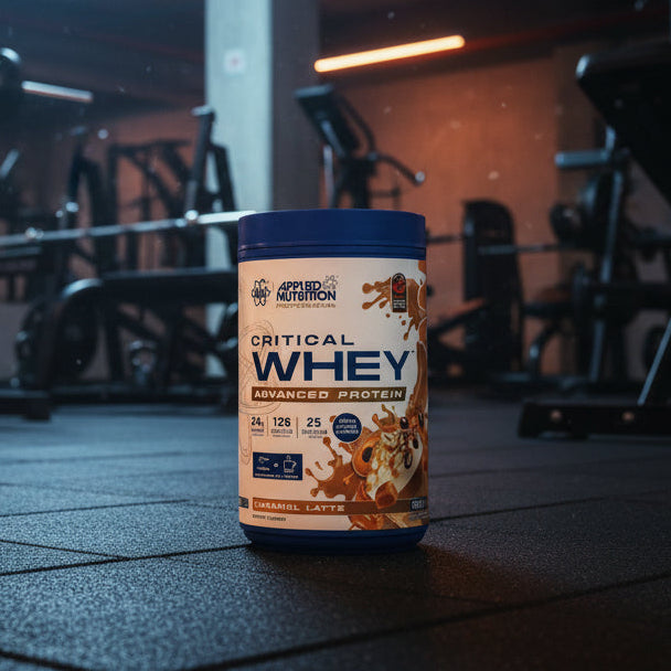 Applied Nutrition Critical Whey Tub on a gym floor