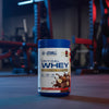 Applied Nutrition Critical Whey Tub on a gym floor